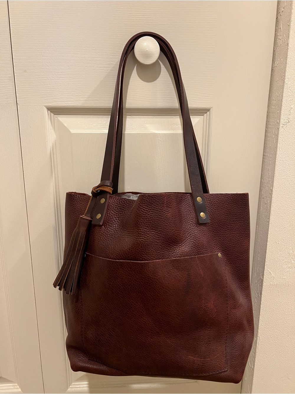 NWOT. Portland Leather Brown Tote with Tassel & Brass Accents.